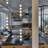 Plusieurs suspensions VVV modulaires DCW éditions, éclairage design Maison Caldeira

